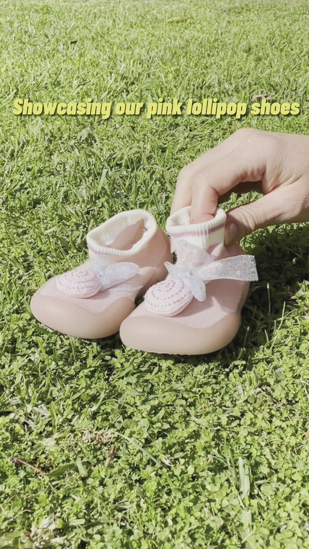 Showcasing pink lollipop children's shoes 