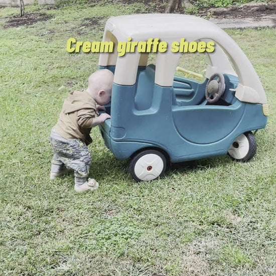 Playing in the garden with cream giraffe shoes