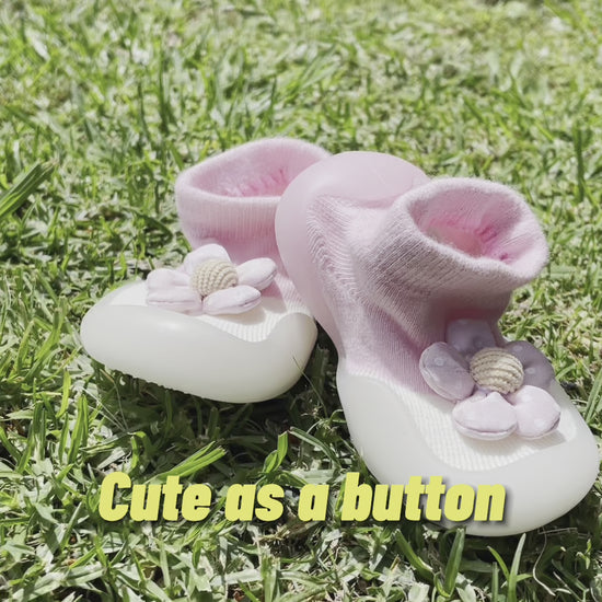 Showcasing pink and white flower kids shoes